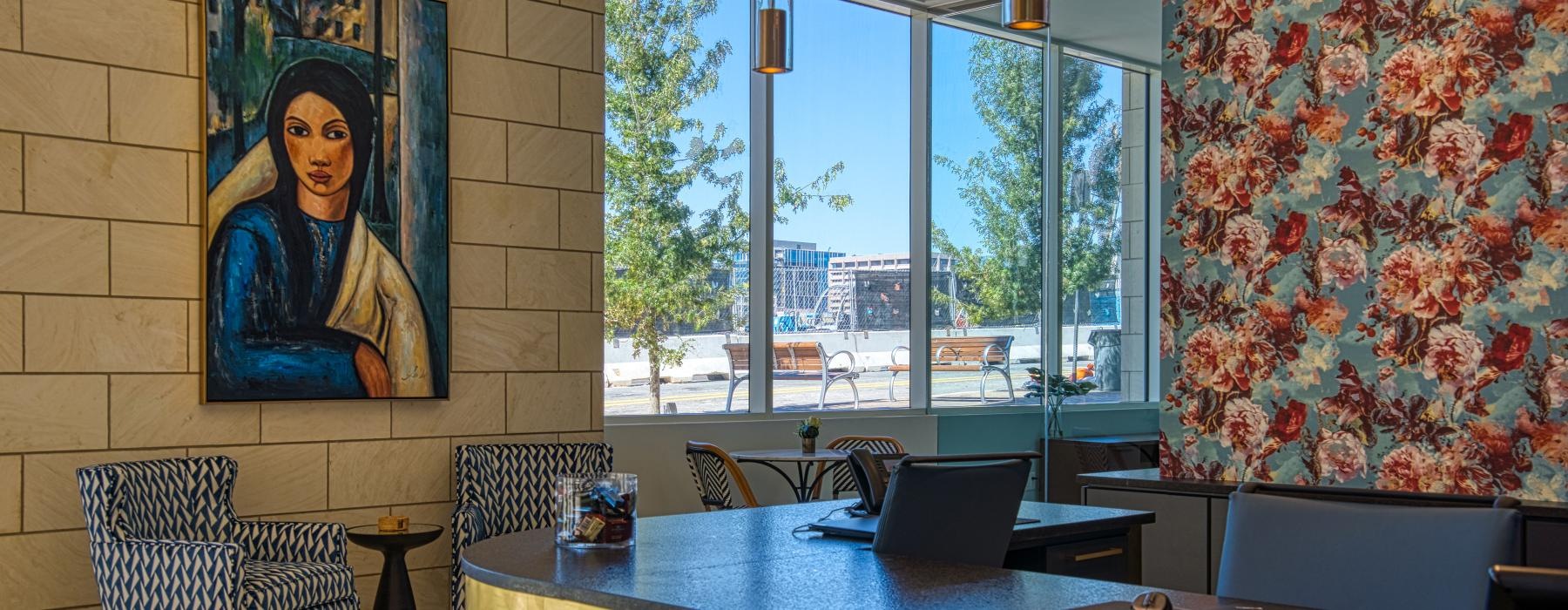 a spacious lobby with a table and chairs