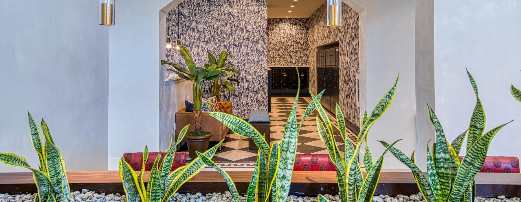 a room with a table and plants