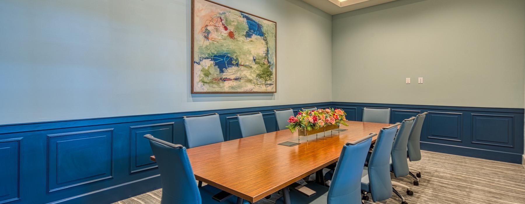 a conference room with a table and chairs