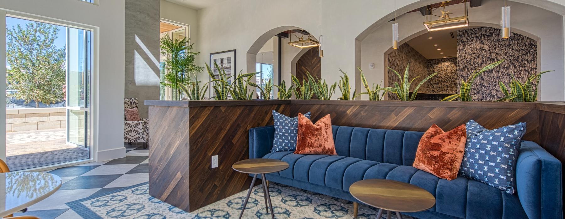 a spacious room with a blue couch